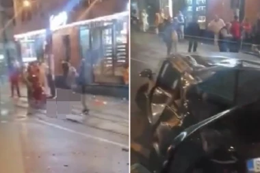 PRVI SNIMAK NAKON JEZIVE NESREĆE U BEOGRADU: Telo mladića na trotoaru, očevici pokušavaju da mu pomognu (VIDEO)